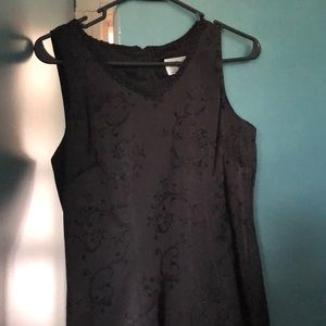 Classic little black dress with beaded designs.